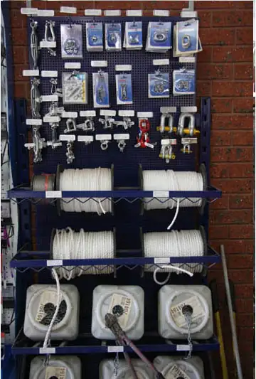 Shackles, hooks and rope on a display stand